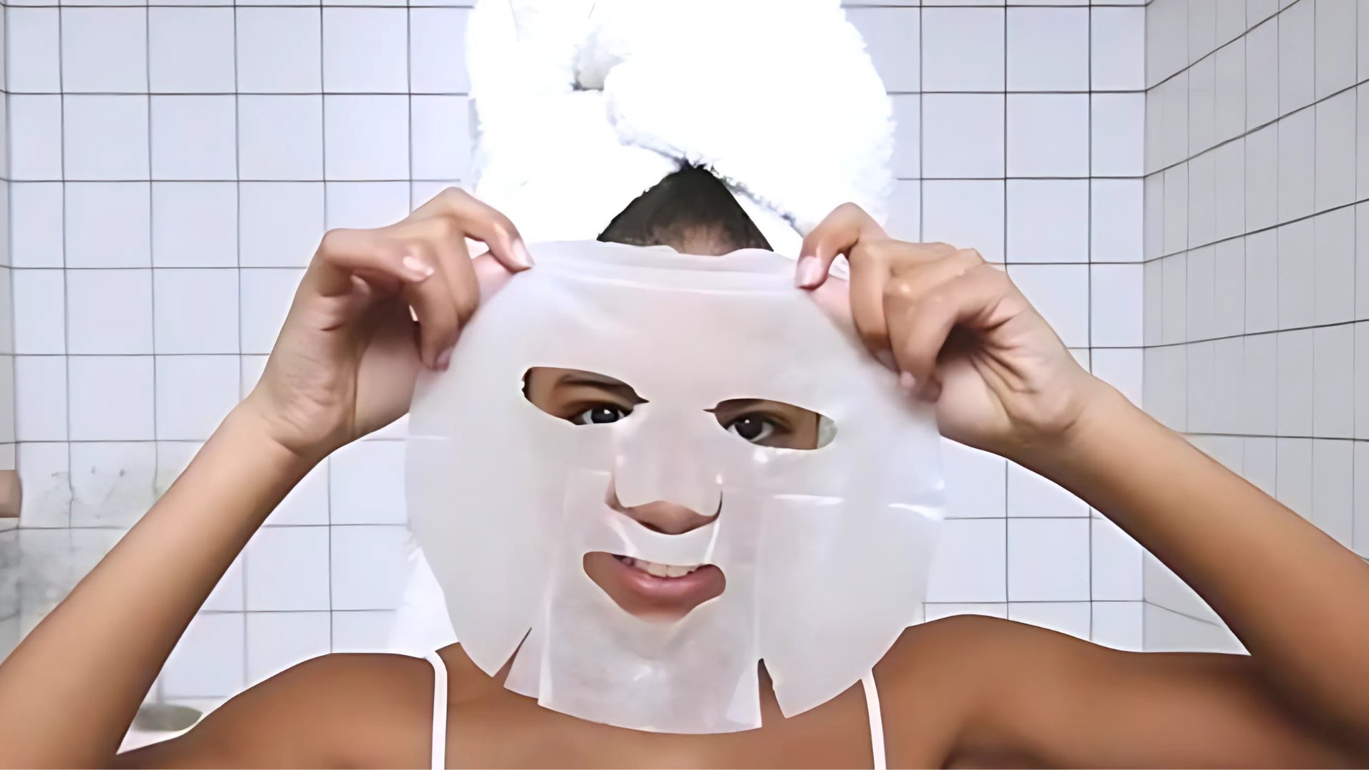 in use woman placing a sheet mask hydrating skincare in the morning