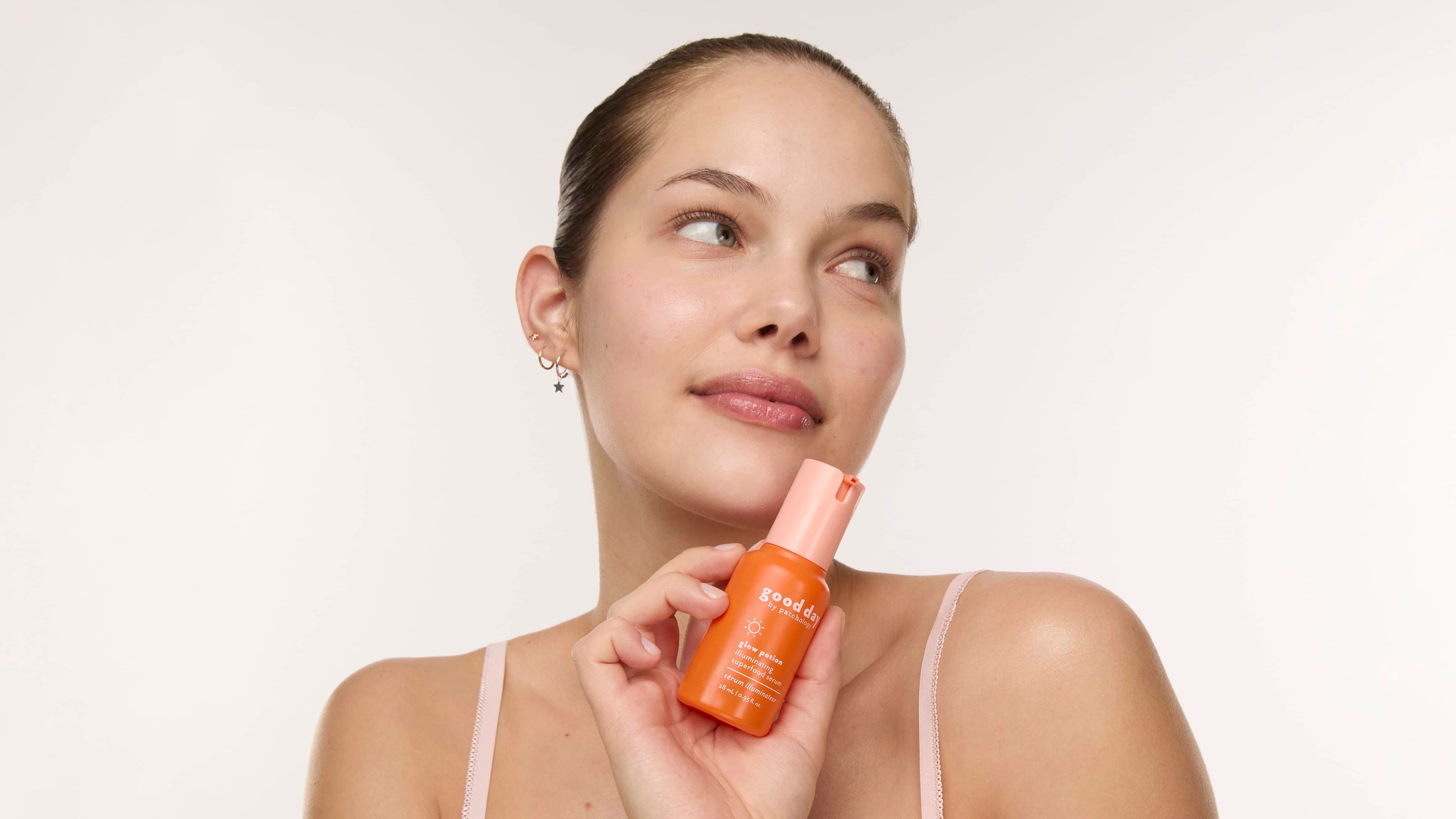 woman applying good day glow potion