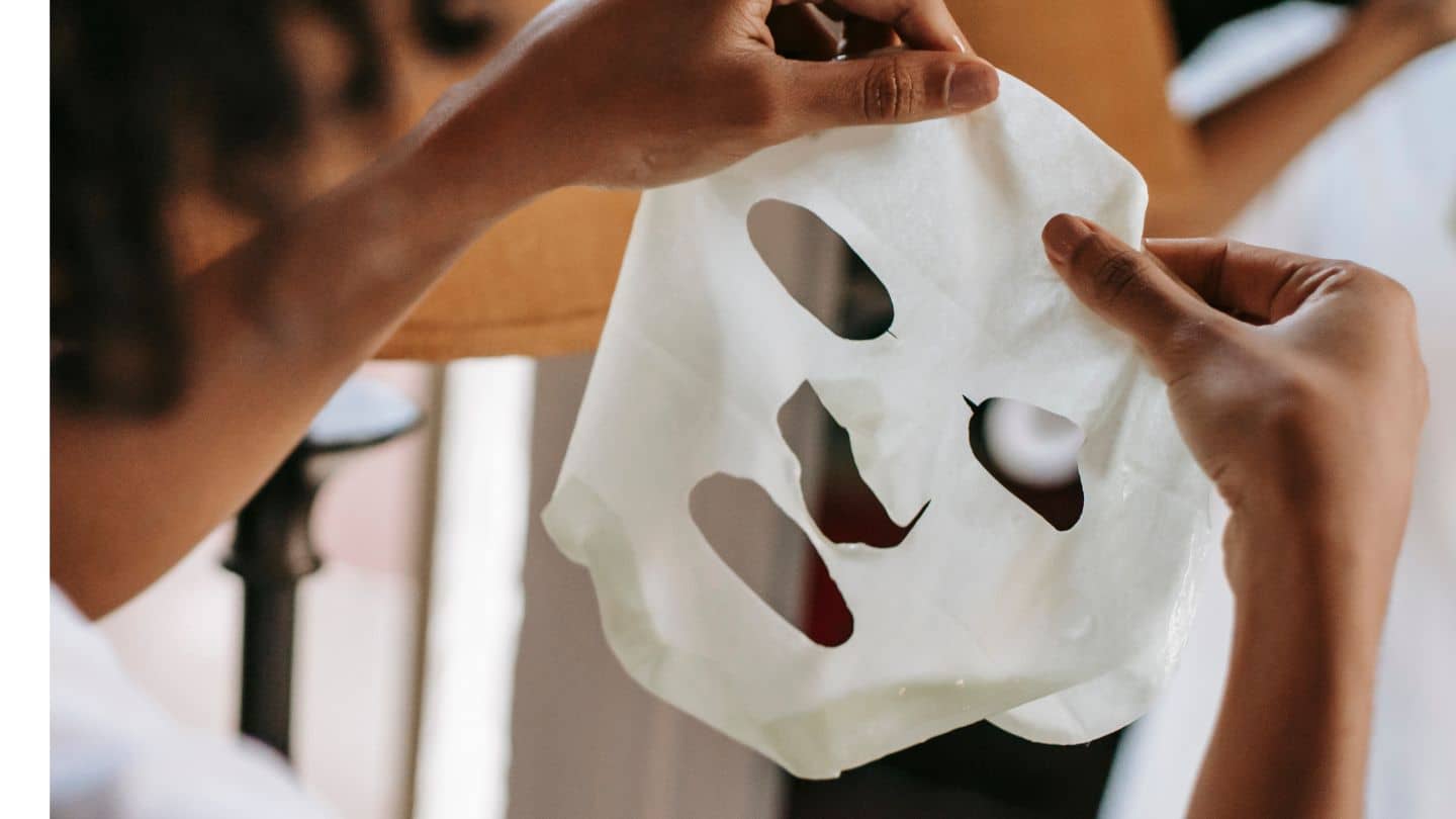 woman holding face mask exfoliate mate