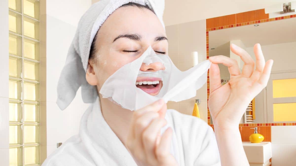 woman wearing a sheet mask to hydrate and restore dry skin uneven and combination skin