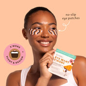 Woman wearing smore-patterned eye patches with a product package in front of her.
