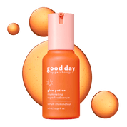 Good Day Glow Potion Illuminating Superfood Serum in a 28 mL bottle, featuring a vibrant orange body and a light pink cap, set against a dark green background with abstract orange liquid splashes.