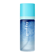 A bottle of Good Day Crystal Clear Refreshing Mineral Micro Facial Mist, featuring a light blue cap and a blue-to-clear gradient bottle, centered on a solid green background.