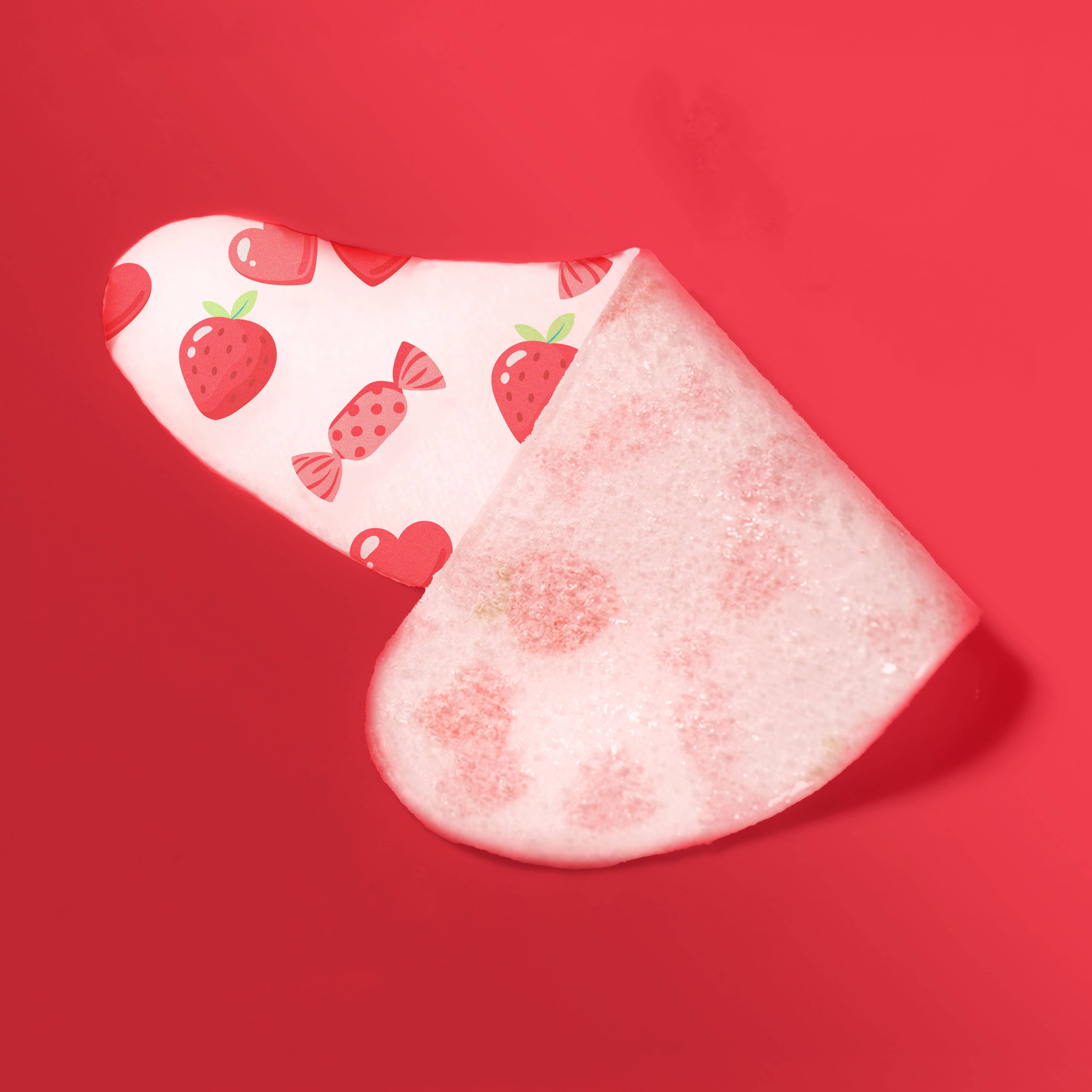 eye mask with strawberry and candy pattern on a red background