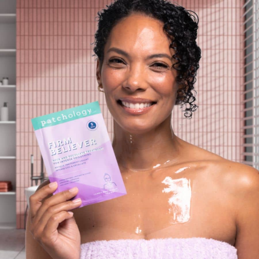 Woman wearing neck and chest smoothing fine lines firm believer masks