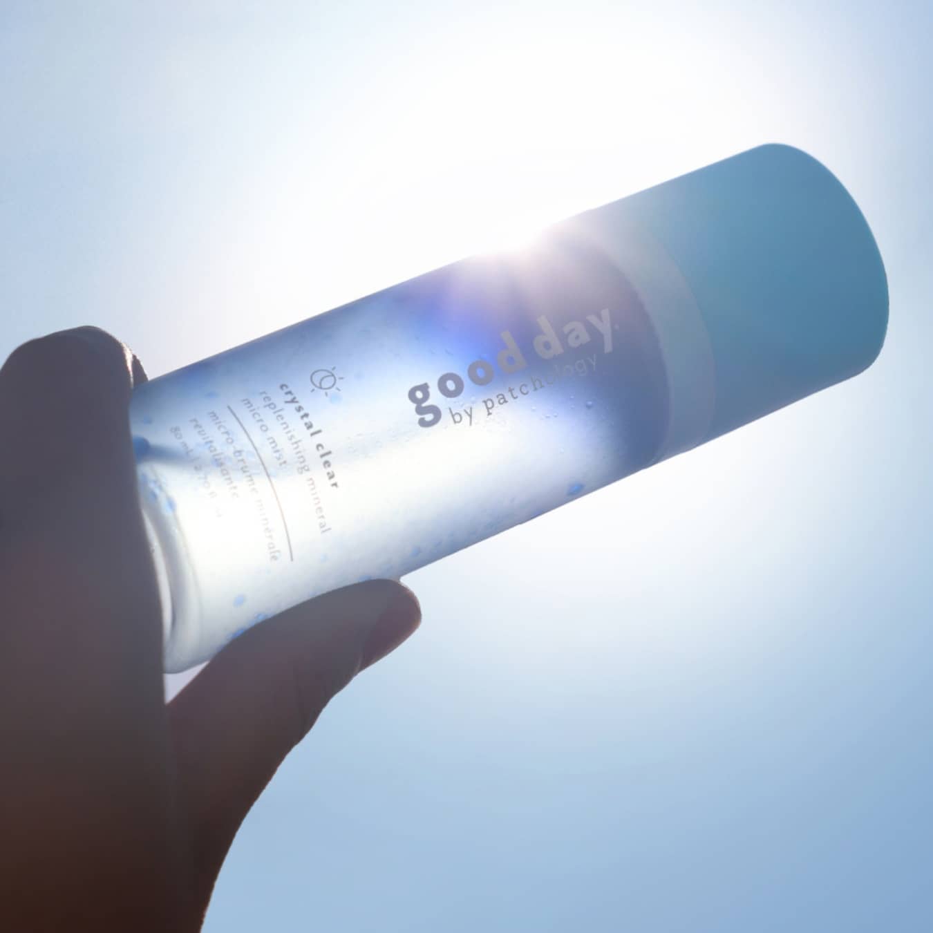 good day facial mist on a blue sky