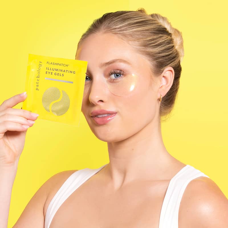 woman using illuminating undereye patches eye mask for dark circles