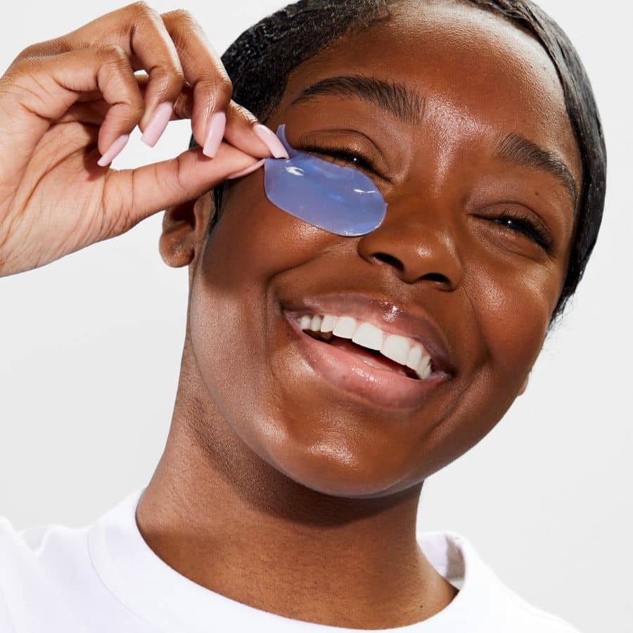 woman wearing on ice eye masks to depuff and firm undereyes