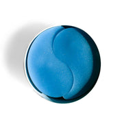 Blue restoring night retinol eye patches on a white background