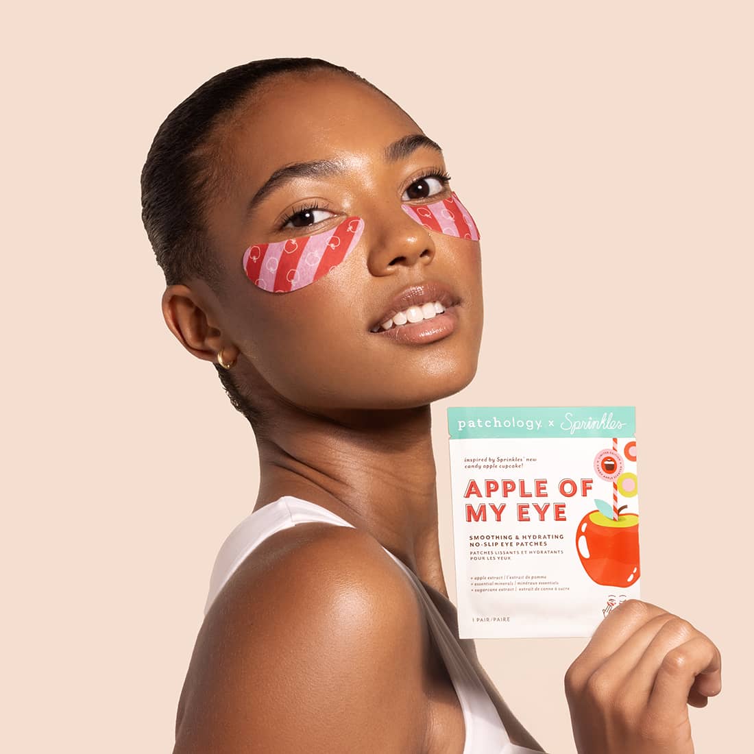 patchology-sprinkles-exclusive-eye-patch-candy-apple-woman-wearing.jpg