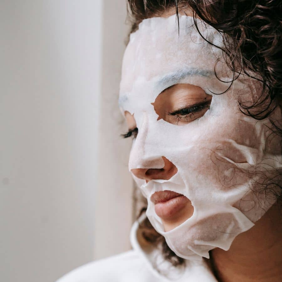 woman wearing playing defense barrier boosting sheet mask