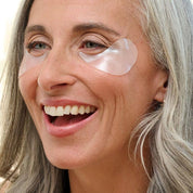 woman wearing under eye patches depuff and smooth dry under eyes dark cirlces