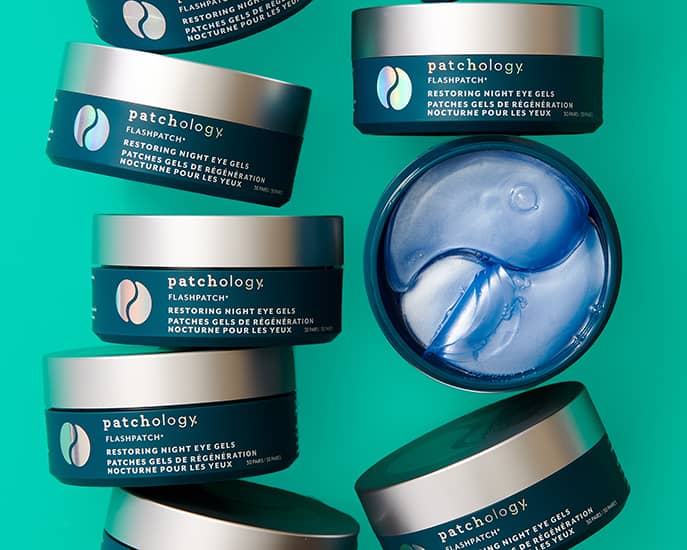 Patchology FlashPatch Restoring Night Eye Gels blue jars and hydrogel patches on teal background for nighttime skincare

