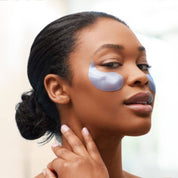 woman wearing restoring night under eye patches