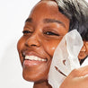 woman removing illuminating sheet masks dewy hydrated skin