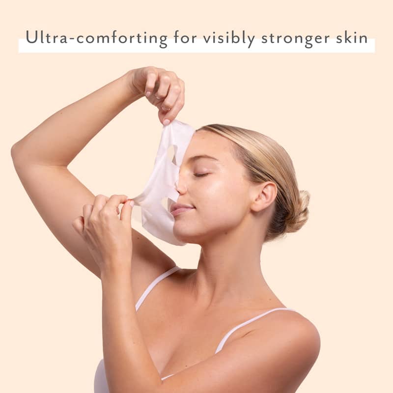 woman wearing sheet mask ultra-comforting for visibly stronger skin sensitive skincare