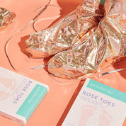 woman wearing hydrating and renewing dry cracked feet rose toes kit